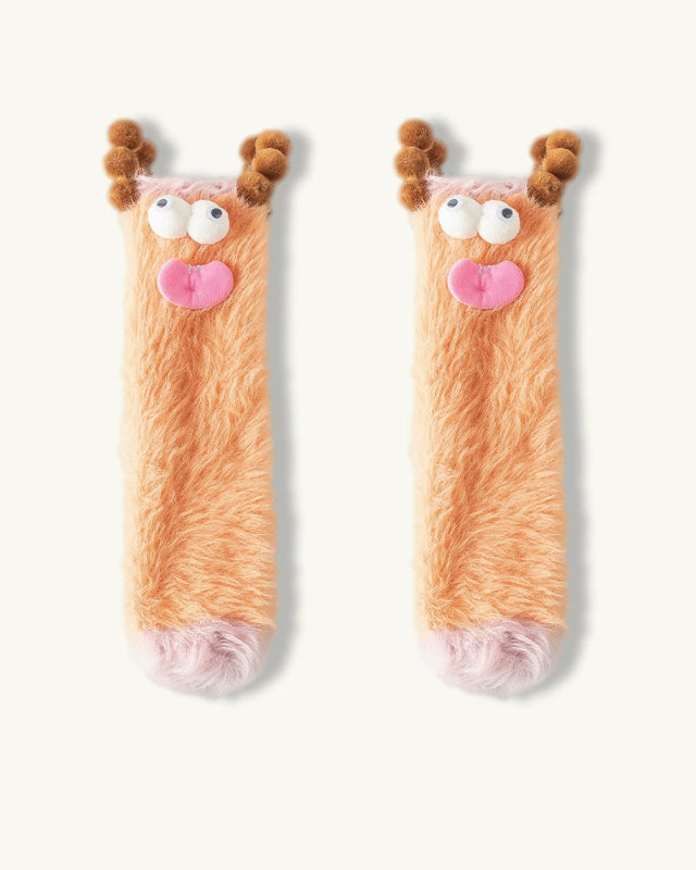 Pair of novelty socks with reindeer design on a white background